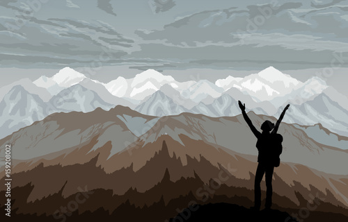 Hiker enjoying landscape with mountains.