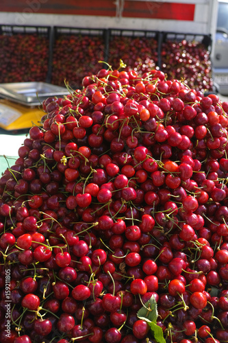 New harvest of fresh ripe red sweet cherry, street market in Italy