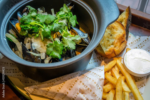 Hoegaarden Mussel pot chopped coriander, fennel, lemon zest and Hoegaarden beer fries photo