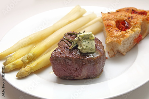 Beef fillet with asparagus and focaccia with tomatoes