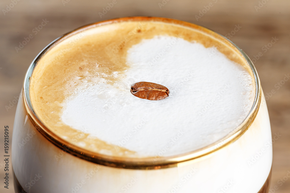 Alcoholic Irish coffee with cream stands on a wooden bar counter. Warming cocktail, space for text Alcoholic Irish coffee with cream stands on a wooden bar counter. Warming cocktail, space for text