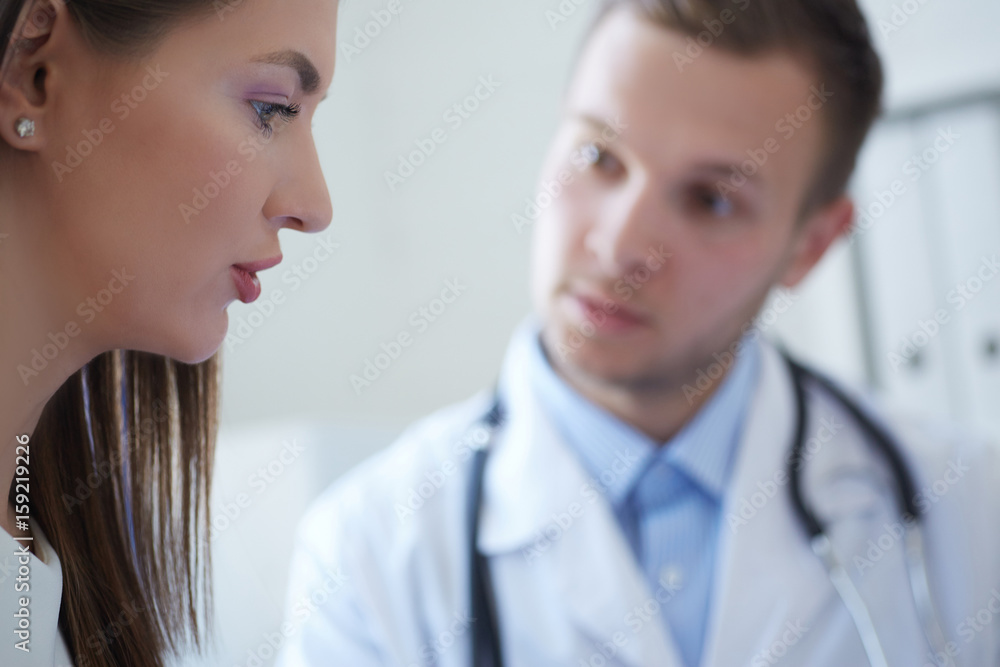Doctor and patient are discussing something, just hands at the table. Doctor and patient are discussing something, just hands at the table.