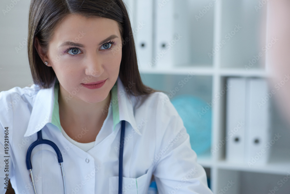 Female doctor giving a consultation to a patient and explaining medical informations and diagnosis Female doctor giving a consultation to a patient and explaining medical informations and diagnosis