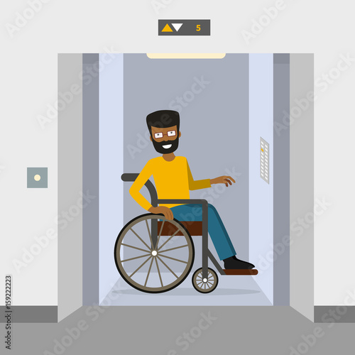 A man in a wheelchair using elevator