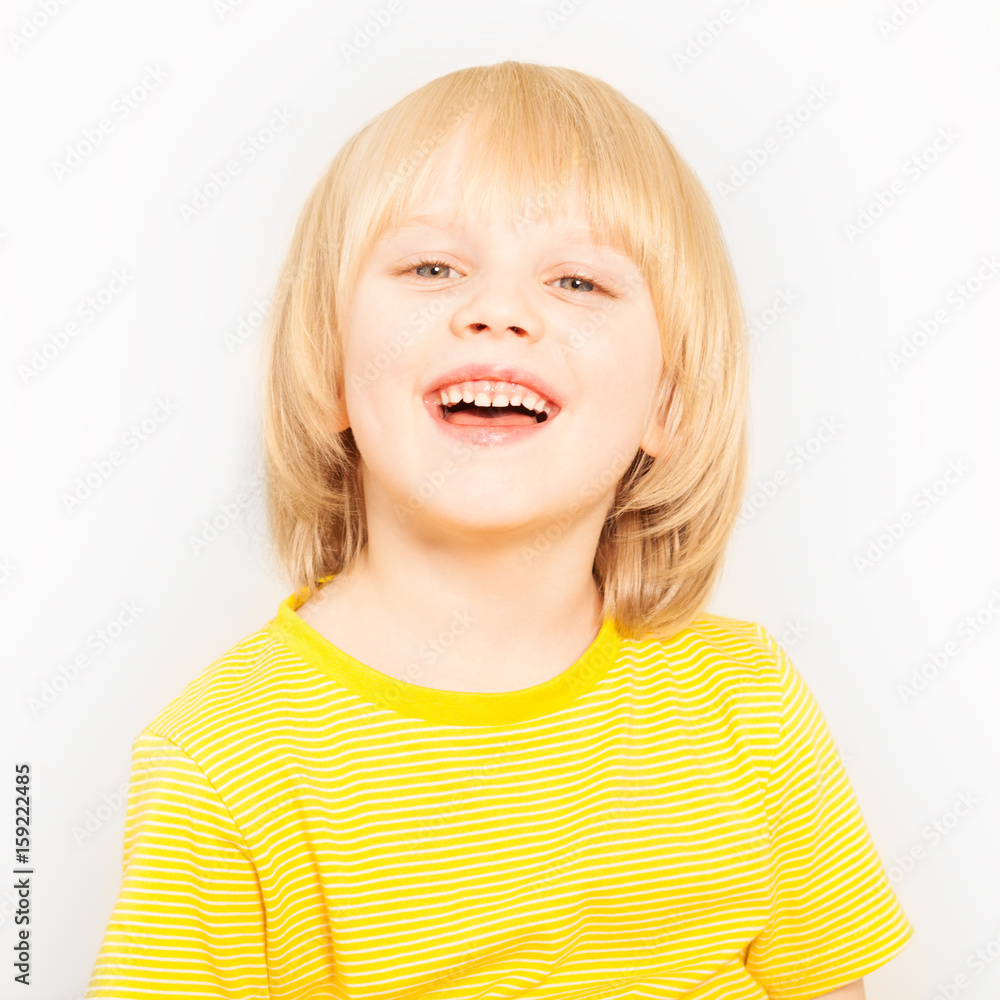 Close-up portrait of joyful boy looking at camera Close-up portrait of joyful boy looking at camera