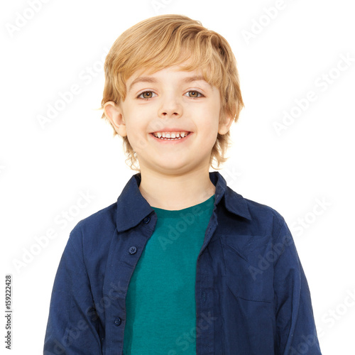 Close-up portrait of joyful blond schoolboy photo