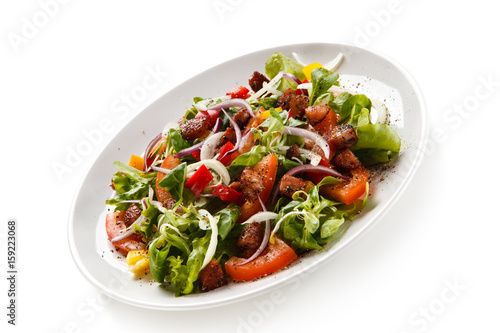 Salad with smoked ham on white background 