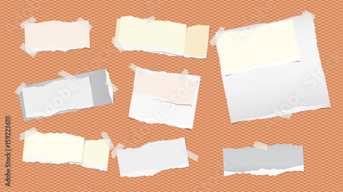 Pieces of ripped white and colorful note, notebook, copybook paper strips stuck with sticky tape on squared orange background.