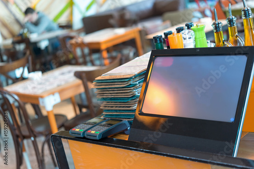 Point of sale, POS , table credit card terminal in modern restaurant