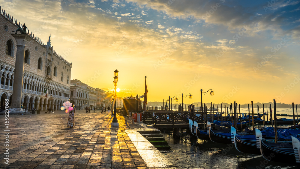 Piazza San Marco at Venice, Italy at sunrise with sunbeams.