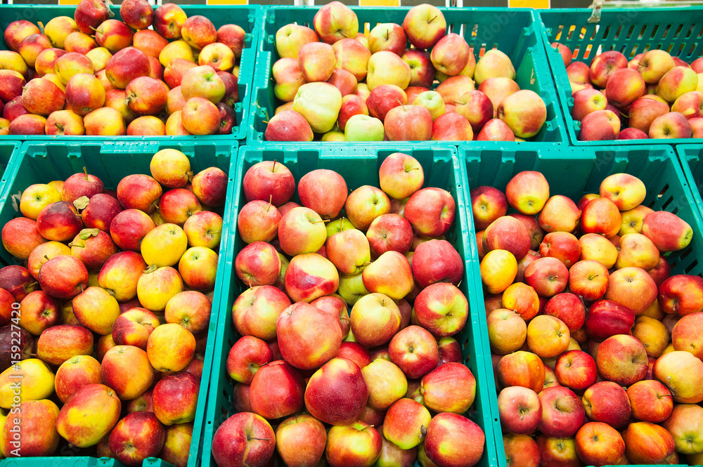 Apples on boxes in supermarket