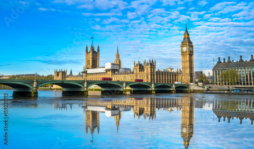 Big Ben and Westminster parliament with blurry refletion in London, United Kingdom at sunny day. photo