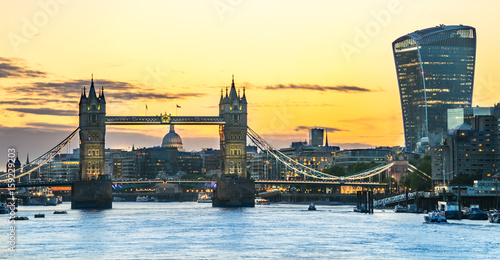 London skyline at sunset including Tower Bridge and skyscrapers at financial district photo