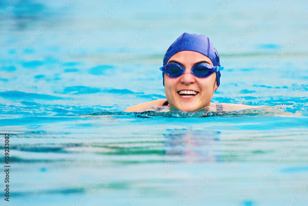 Smiling swimming woman
