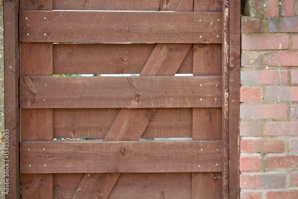 Old brown wood door with parts of wall Old brown wood door with parts of wall