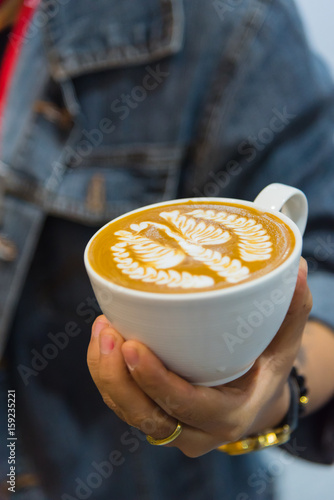 Barista pouring latte froth make coffee latte art