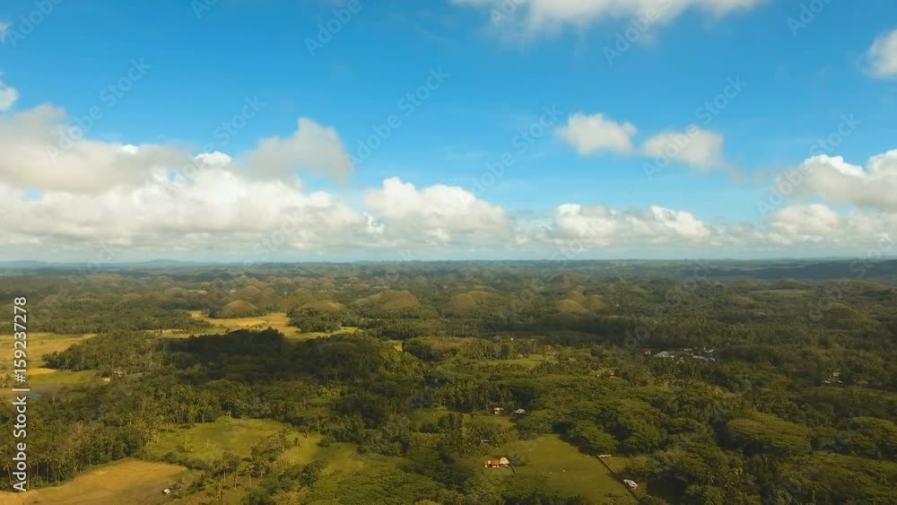 Amazingly shaped Chocolate hills on sunny day on Bohol island, Philippines. Aerial view Chocolate Hills in Bohol, Philippines are earth mounds scattered all over the town of Carmen. 4K video. Travel Amazingly shaped Chocolate hills on sunny day on Bohol island, Philippines. Aerial view Chocolate Hills in Bohol, Philippines are earth mounds scattered all over the town of Carmen. 4K video. Travel