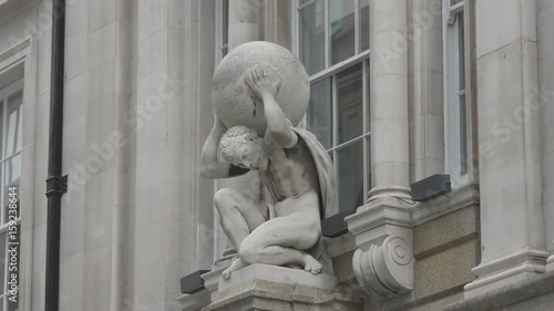 Statue of the Atlantean holding the planet.