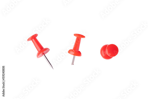 red pin in three different stances isolated on white background