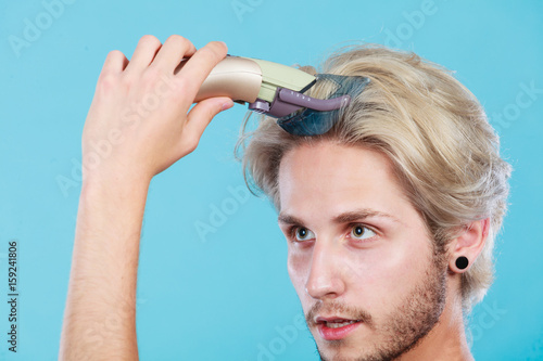 Man going to shave his long hair