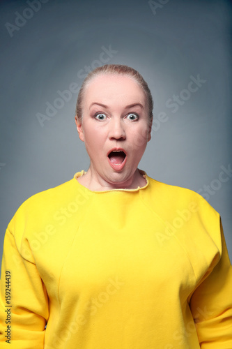 Portrait of amazed mature w...