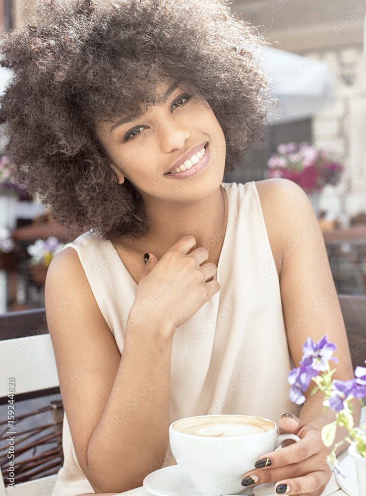 African american girl drinking coffee. African american girl drinking coffee.