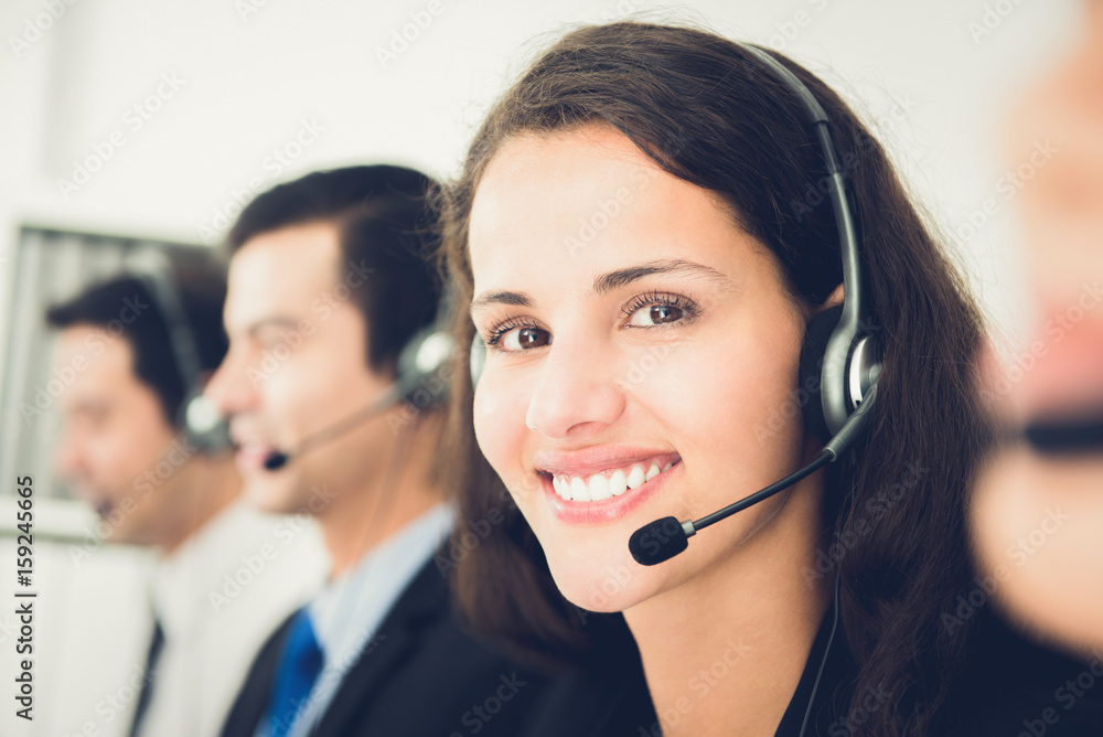 Beautiful smiling woman working in call center Beautiful smiling woman working in call center