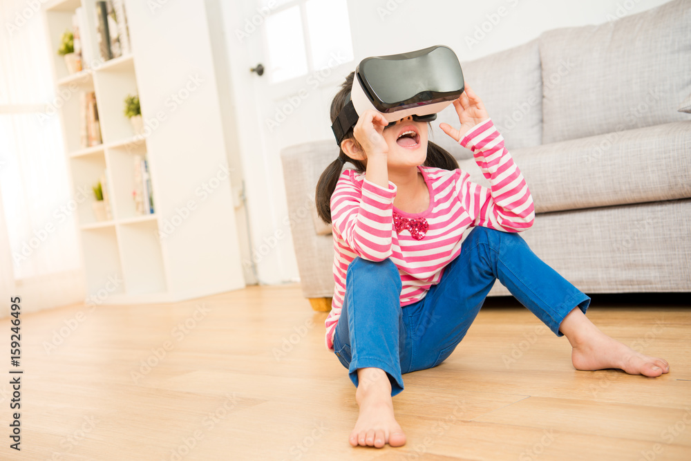 kid using a virtual reality goggles shocked kid using a virtual reality goggles shocked