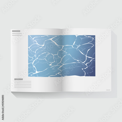 Open magazine book with water in the middle page