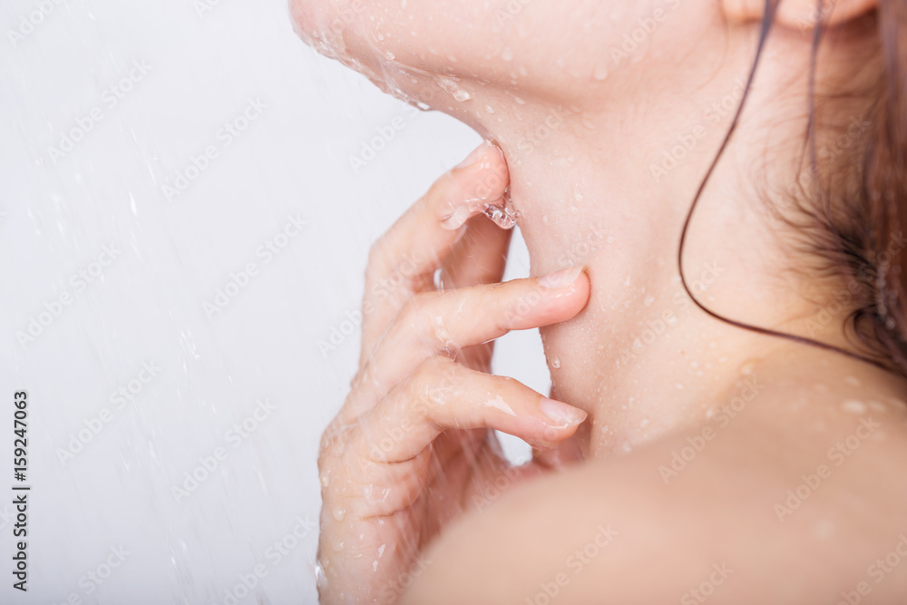 Fototapeta premium hand with neck of woman which take a shower