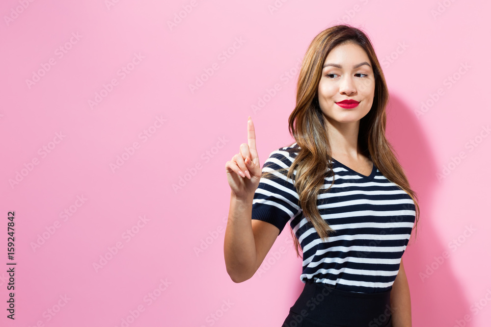 Young woman pointing something Young woman pointing something