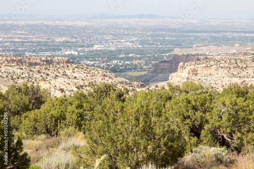 View of Farmington, New Mexico through canyon and pinions on the Navajo reservation
