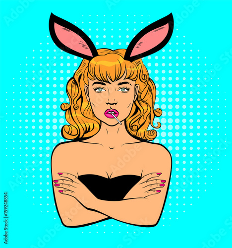 Beautiful young woman with rabbit ears holding mouthful of lollipop