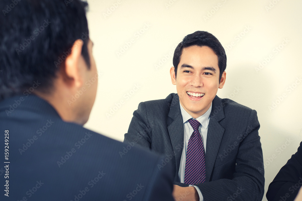 Happy young Asian businessman in the meeting Happy young Asian businessman in the meeting
