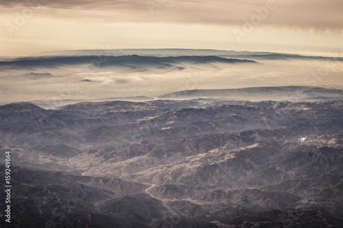 Aerial view of rolling hills in California with fog