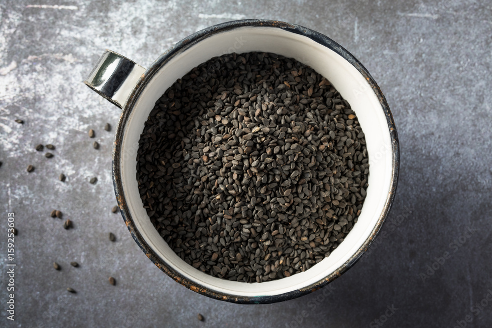 Black Sesame Seeds in a Metal Cup