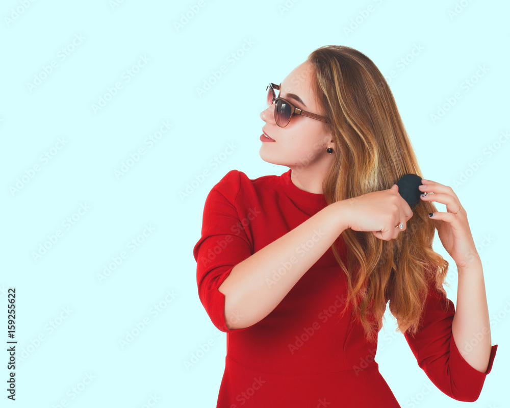 Naklejka premium Young pretty woman, sunglasses, white background 