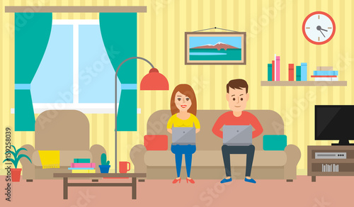 couple with  notebooks sitting on the sofa in living room interior
