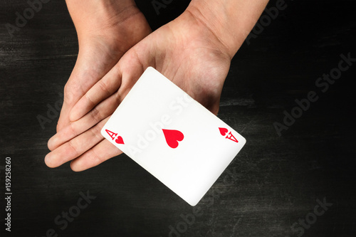 Card levitating above girls hands with copyspace