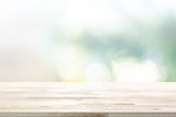 Wood table top on  blur abstract white green bokeh background
