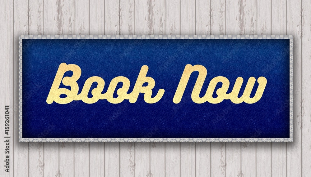 BOOK NOW handwritten on blue leather pattern painting hanging on wooden wall. BOOK NOW handwritten on blue leather pattern painting hanging on wooden wall.