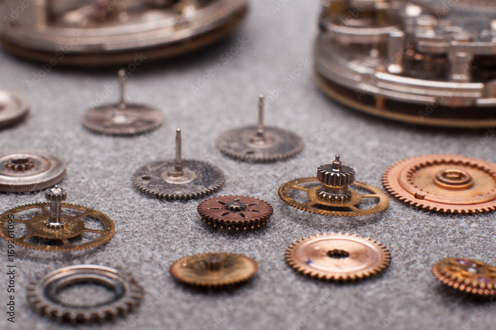 Detail of watch machinery on the table. Detail of watch machinery on the table.