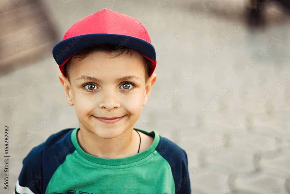 Smiling boy is in casual clothes. Outdoor shot.Copy-space. Smiling boy is in casual clothes. Outdoor shot.Copy-space.