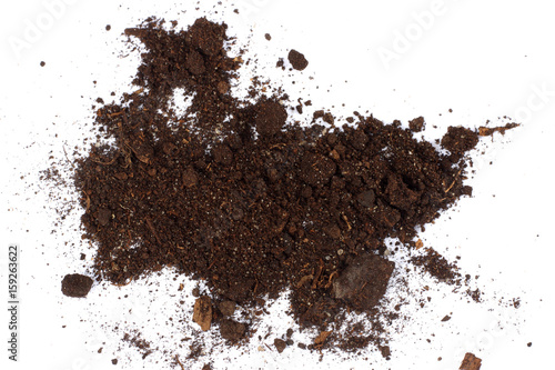 Soil, ground, brown land isolated on white background. Organic gardening, agriculture. Nature closeup. Environmental texture, pattern. Mud on field.