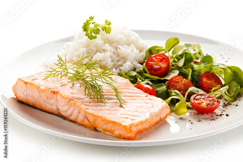 Roast salmon with white rice on white background