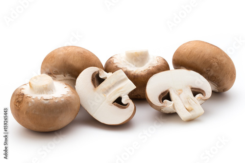 Fresh champignon mushrooms isolated on white.