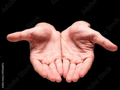 Male hands on a black background.
