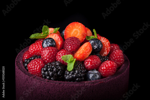 Cake berries on a black background