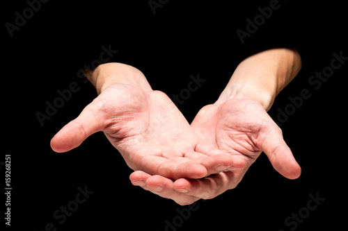 Male hands on a black background.