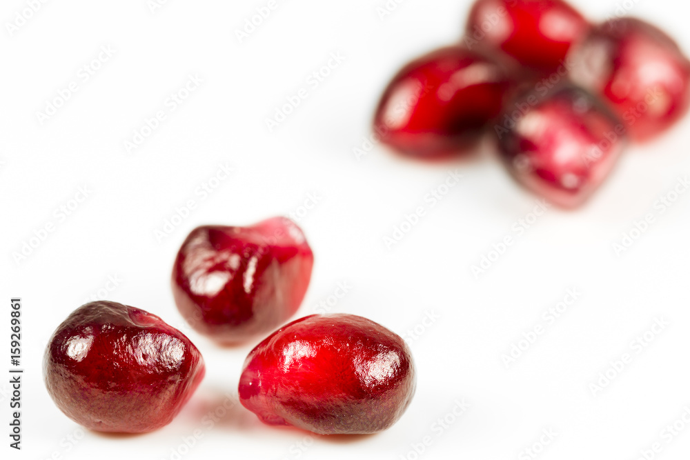 fresh and peeled pomegranate seed on white background fresh and peeled pomegranate seed on white background